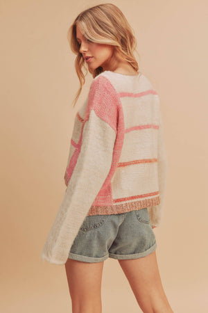 pink and white knit pullover sweater